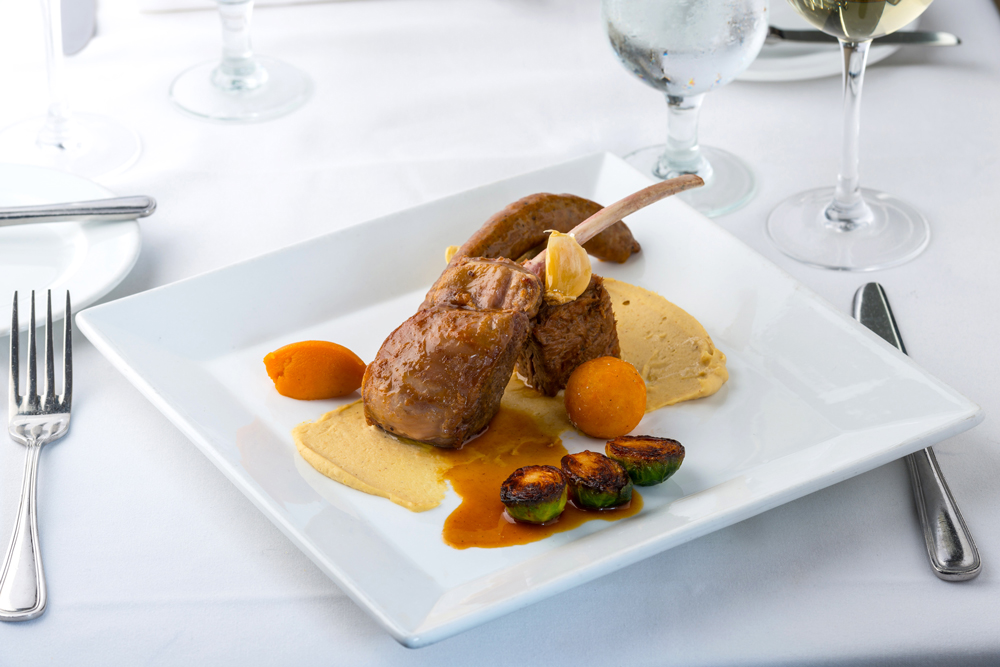 Pascal's on Ponce is a fancy French restaurant in Coral Gables, Florida. This is their Australian Lamb Chop served with braised shoulder merguez sausage, artichokes, pomme dauphine and jus d'Agneau.