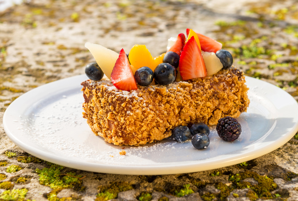 Brioche French Toast topped with season mixed fruit and maple syrup. This is from the restaurant Brasserie Central in Coral Gables.