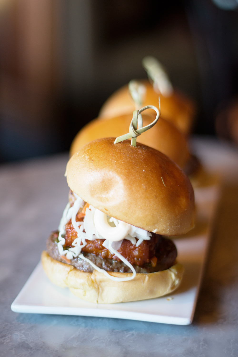 Swensen's Miami Nica Sliders are amazing they have pineapple coleslaw, deep fried queso blanco and plaintain.