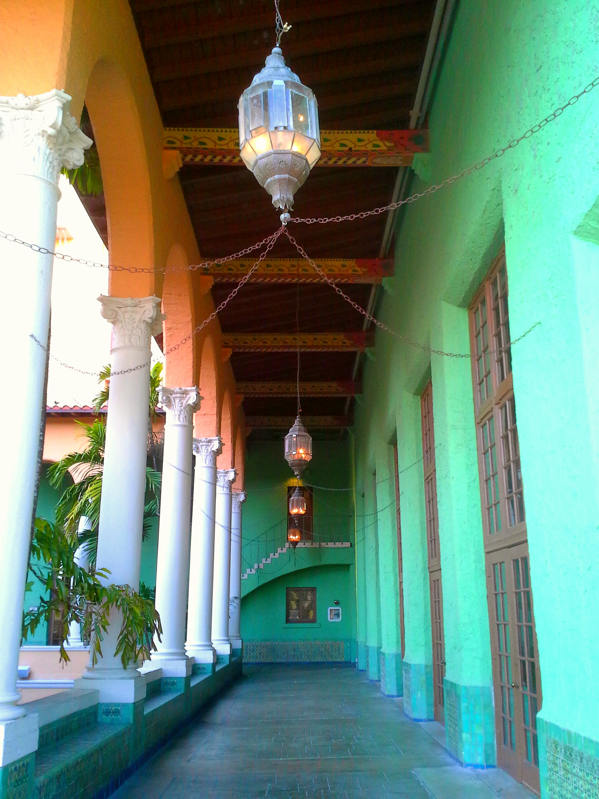 The Biltmore Hotel has an upper courtyard with a long corridor with bright green walls. This is a famous spot for engagement photos