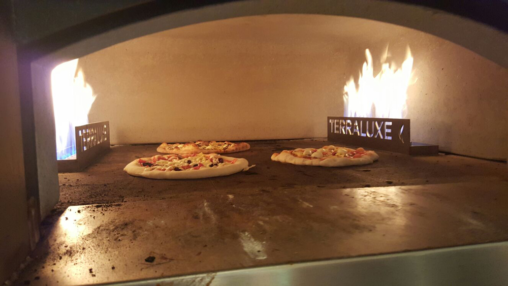 Cibo Wine Pizza Class pizza in the oven.
