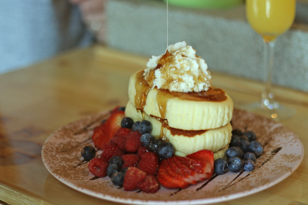 For the FLUFFIEST Pancakes in Miami visit SushiKONG. They are served with maple syrup and berries. SO FLUFFY