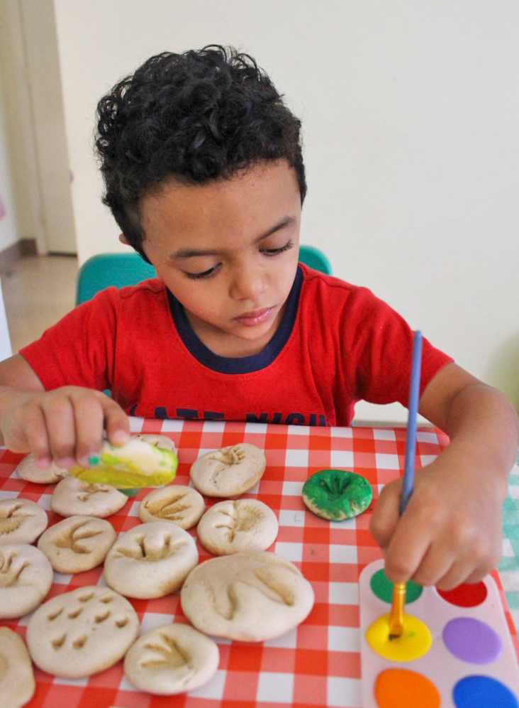 Kids Activities at Home painting dinosaur fossils