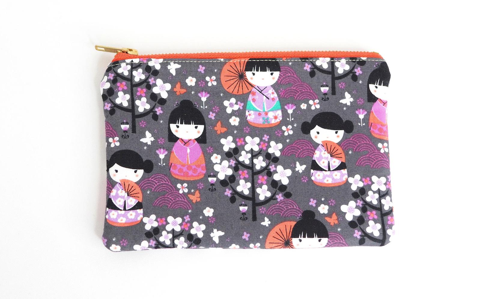 https://s24214.pcdn.co/wp-content/uploads/2020/11/Best-Gifts-For-Her-kokeshi-doll-zipper-pouch.jpg