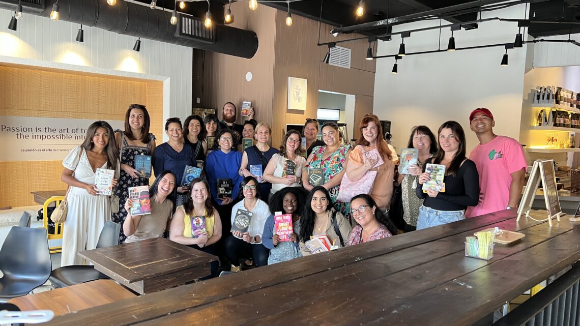 Coral Gables Love REading Party attendee group photo everyone holding a book